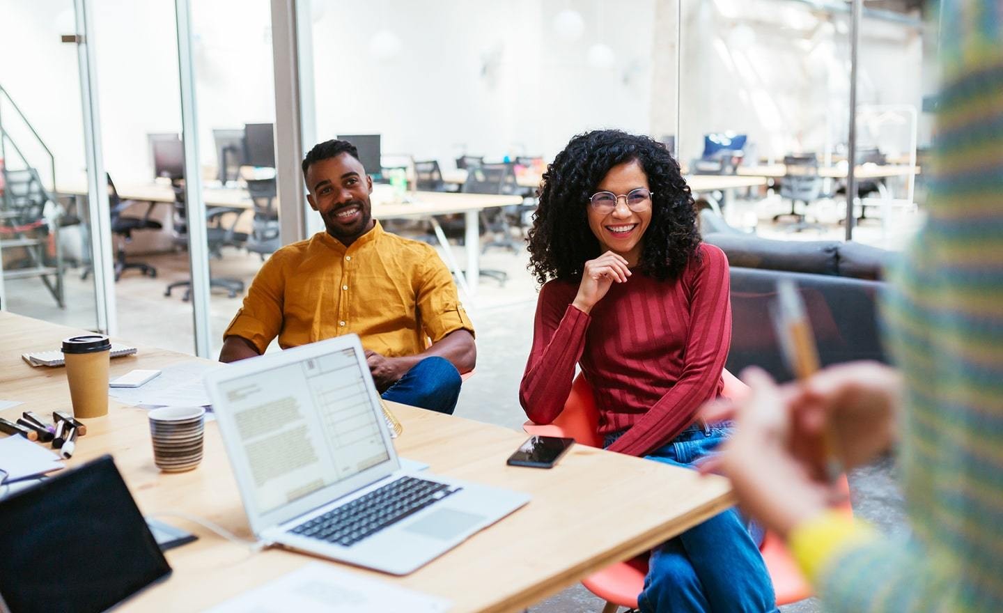 Coworkers meeting around a conference table