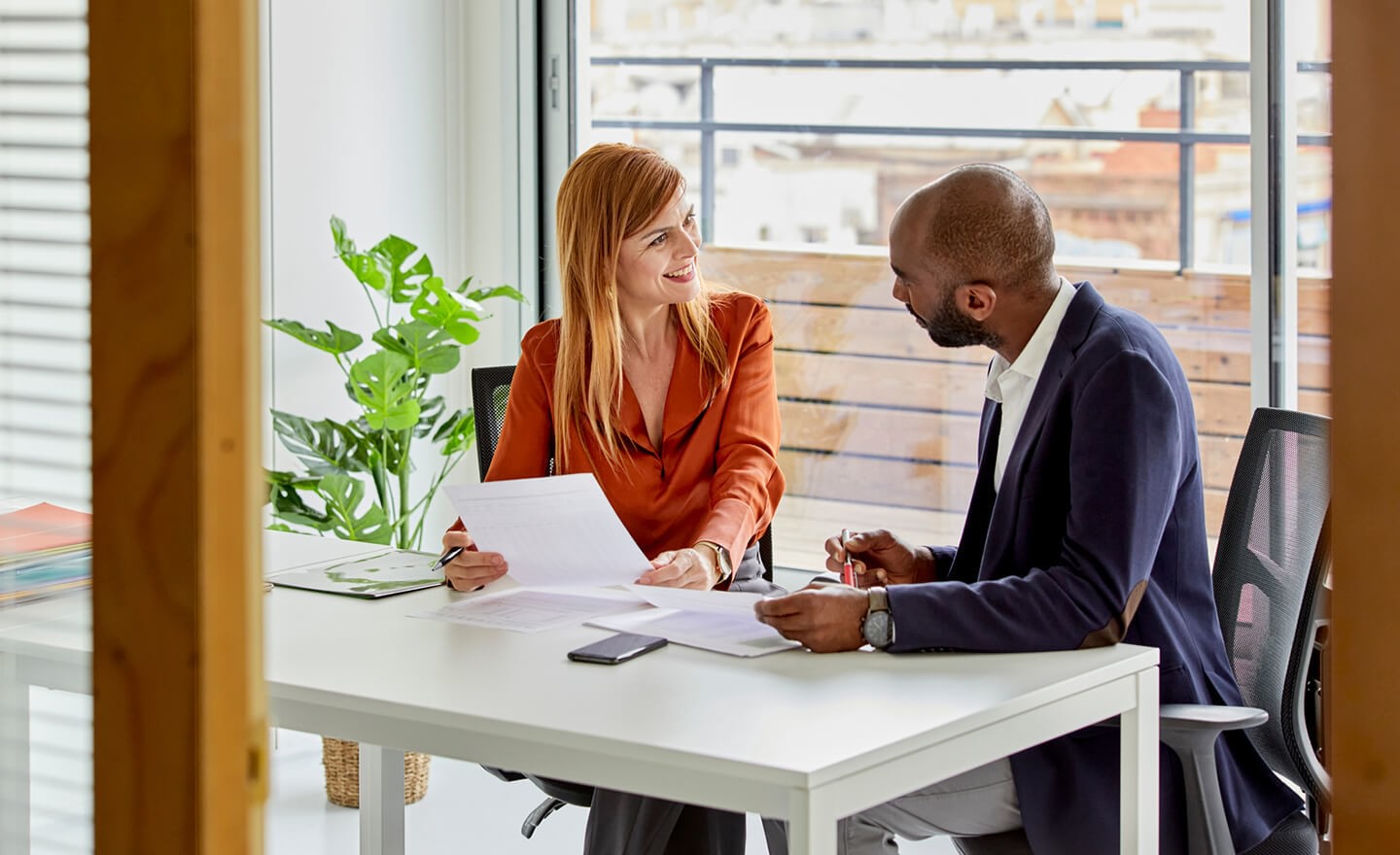 Happy coworkers meeting in office