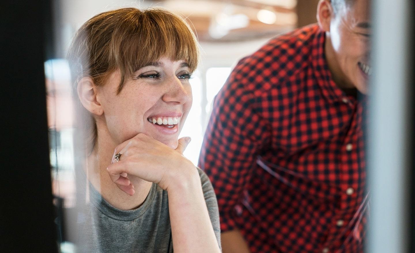 Smiling woman at computer