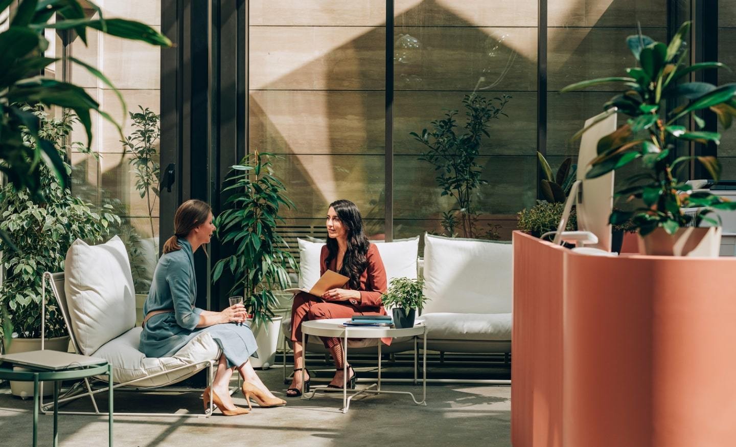 Two coworkers discussing onboarding plan