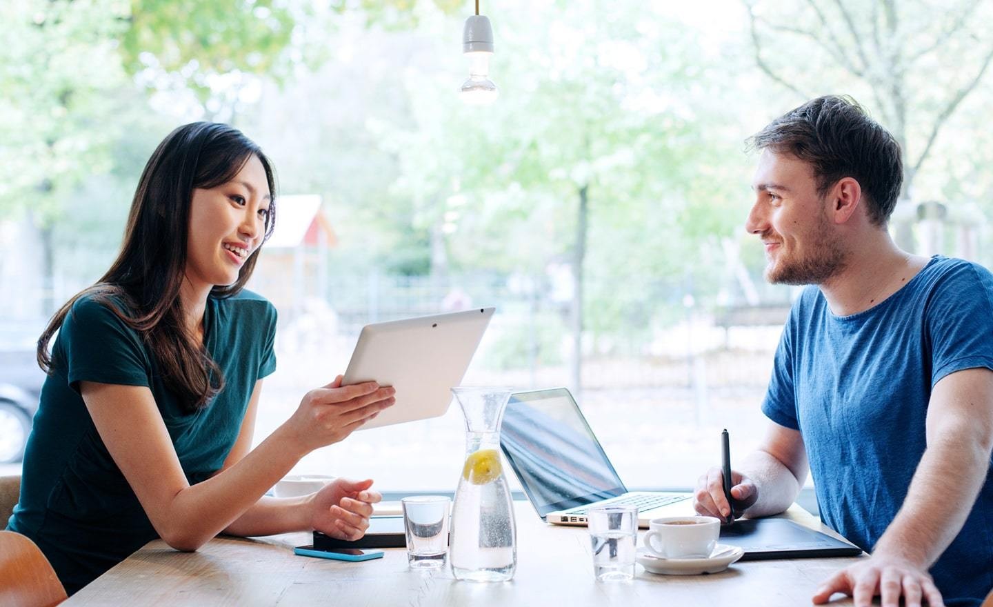 Two people working in a cafe