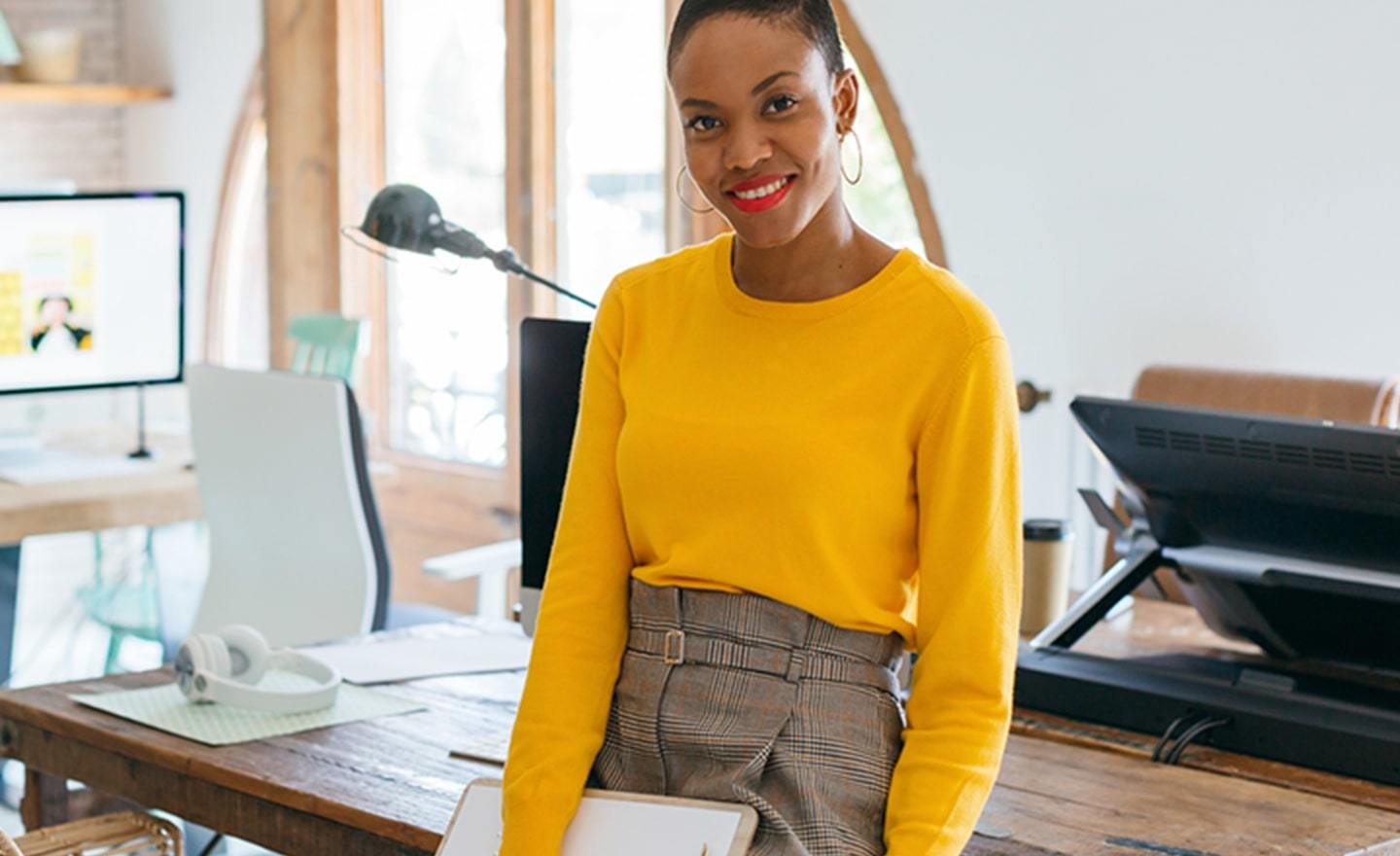 Woman in bright yellow sweater