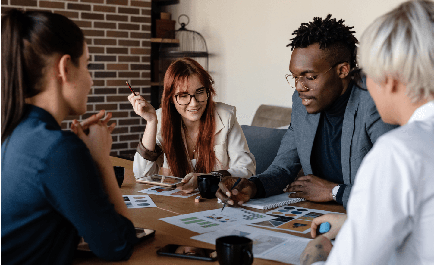 Coworkers discussing project in conference room