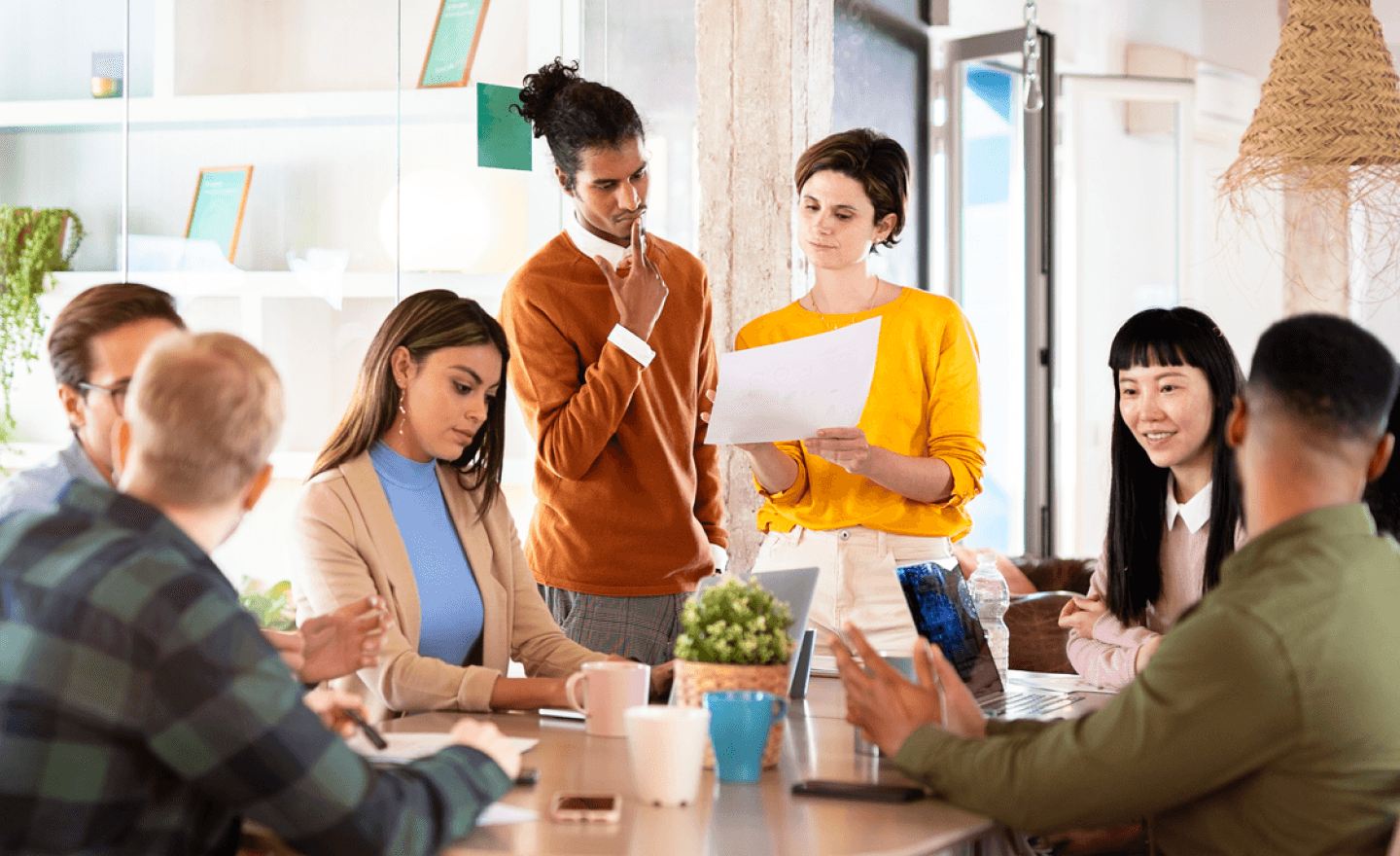 Diverse team of coworkers collaborating during meeting