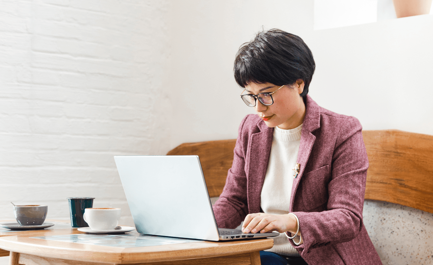 Focused team leader working on laptop