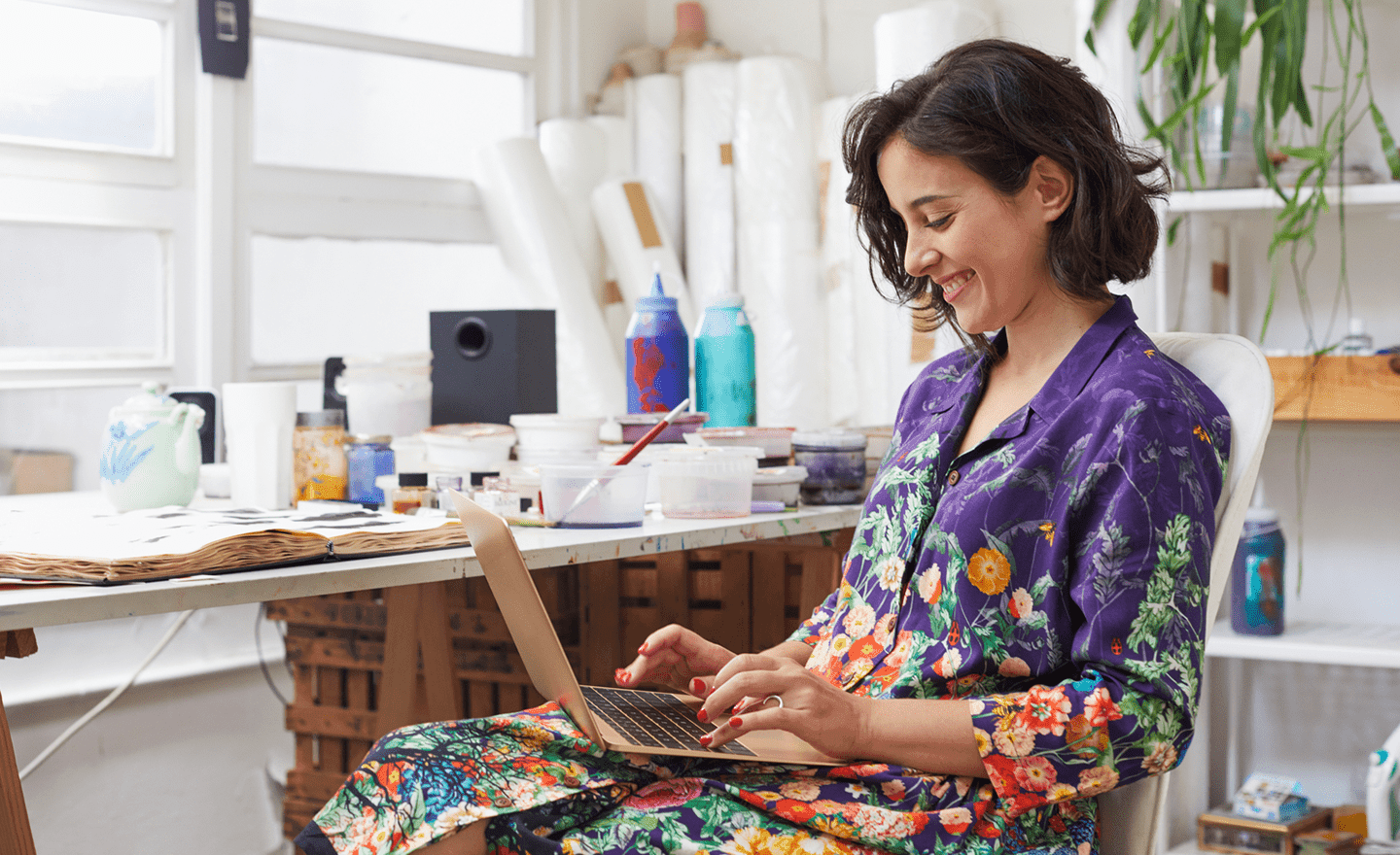 Happy woman working on laptop