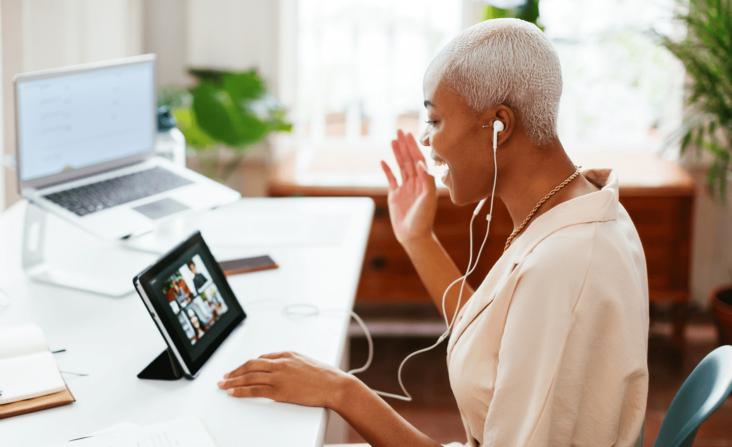 Hiring manager greeting new hires on video call