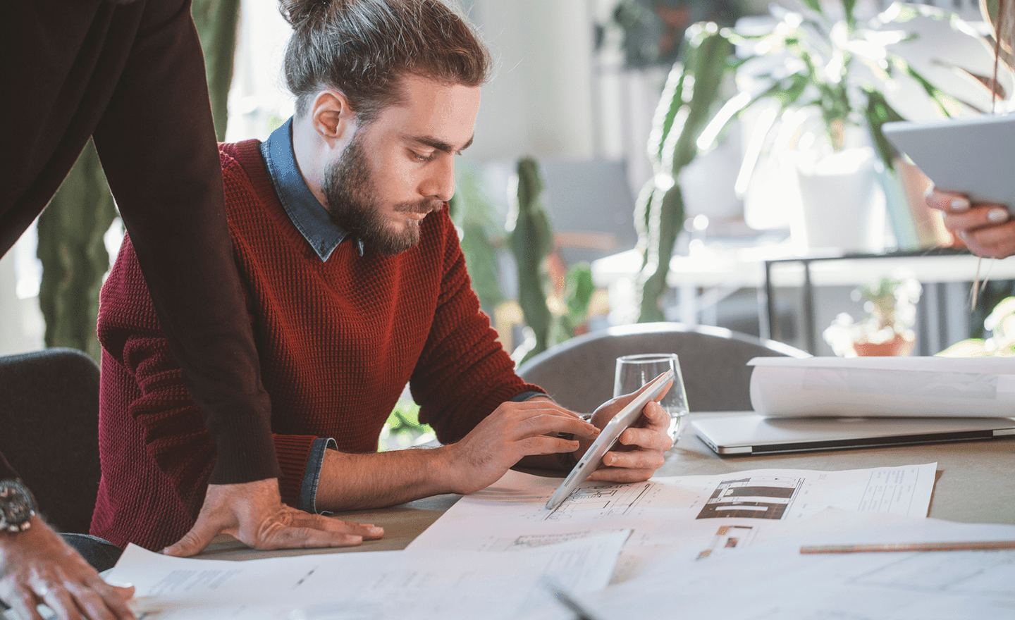 Man working on tablet in meeting 1