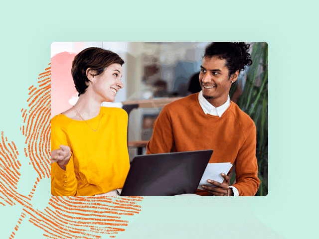 Photo of two coworkers in brightly colored shirts