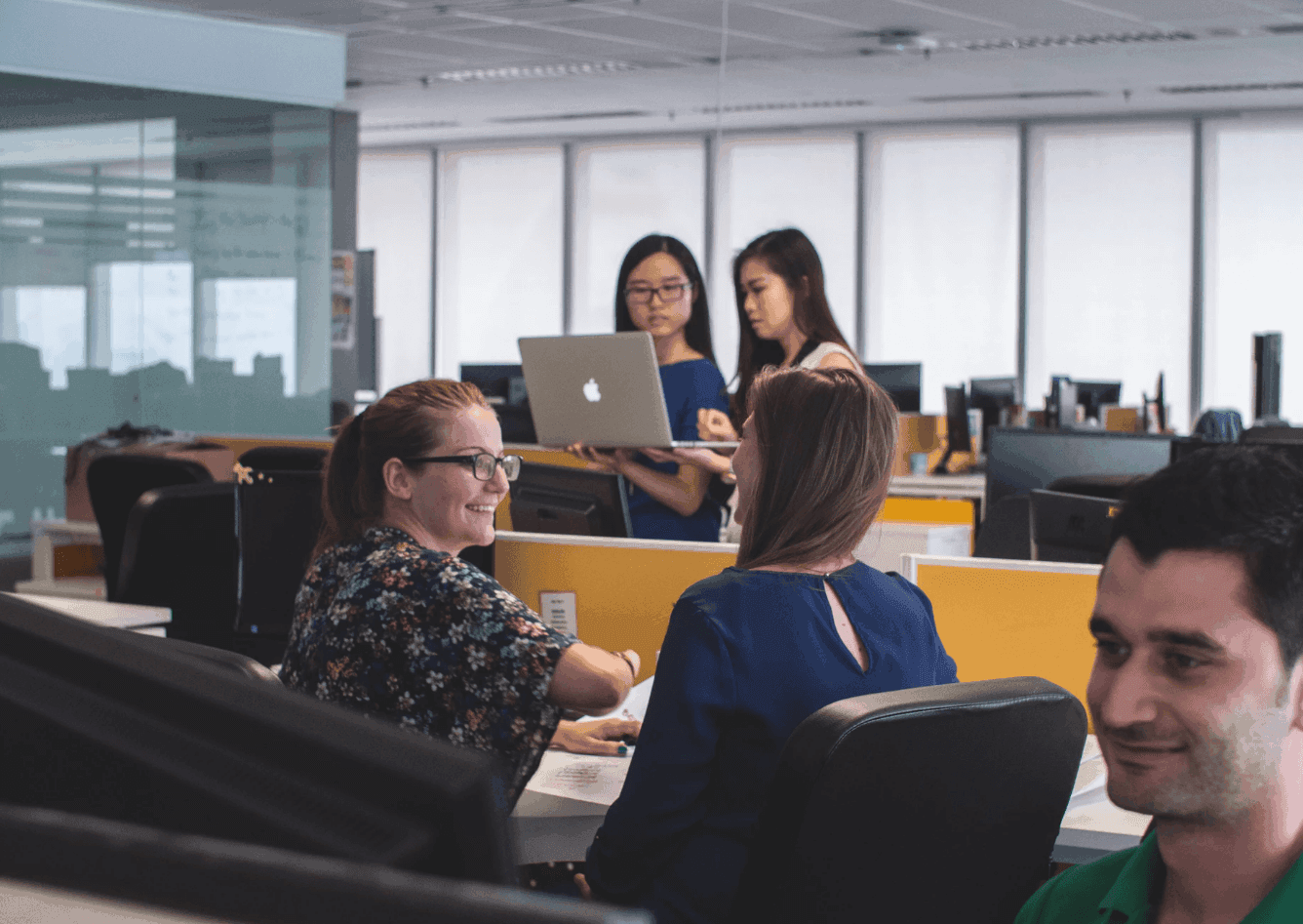 Women facing each other in corporate office